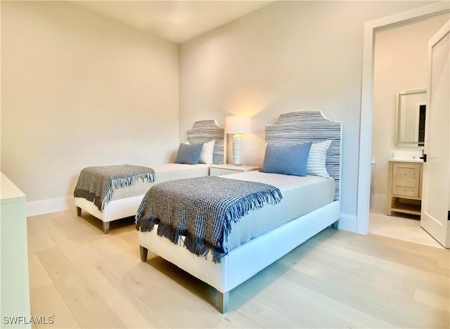 770 Port Side Dr, Naples, FL 34103 - bedroom with light wood-type flooring and ensuite bath