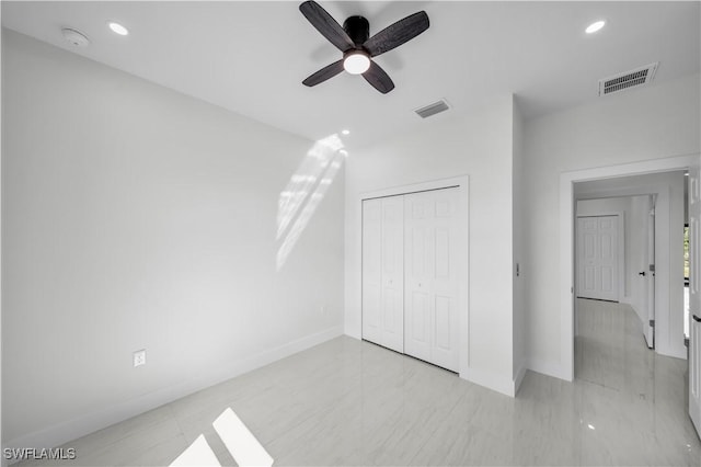 unfurnished bedroom featuring visible vents, a closet, and recessed lighting