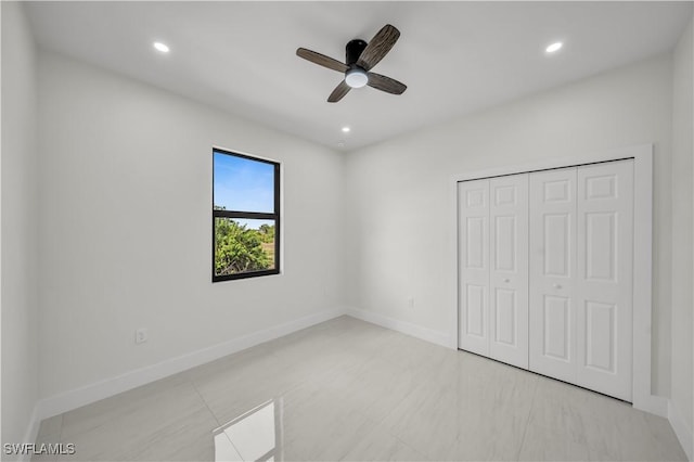 unfurnished bedroom with a closet, baseboards, a ceiling fan, and recessed lighting