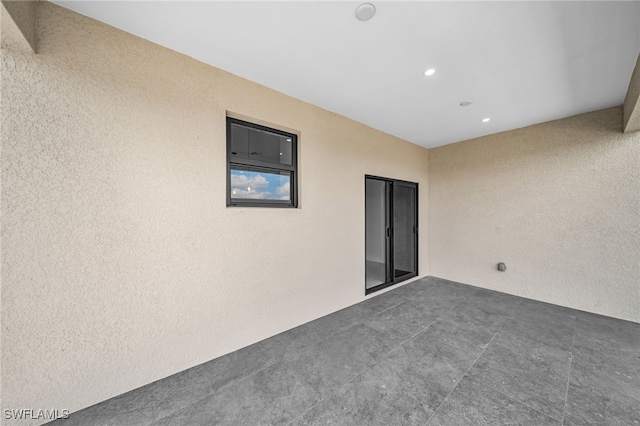 unfurnished room featuring recessed lighting