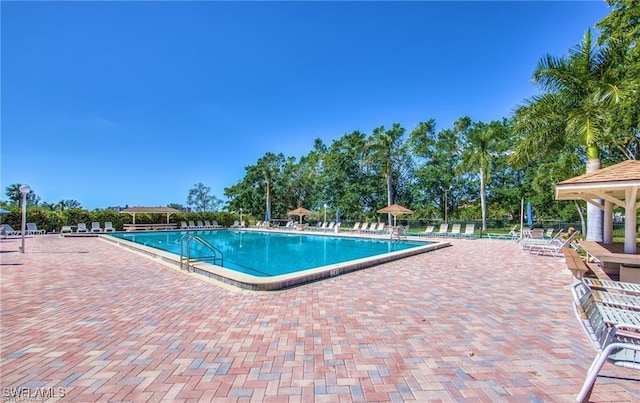 community pool featuring a patio area