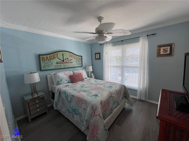 bedroom featuring a ceiling fan, crown molding, baseboards, and wood finished floors