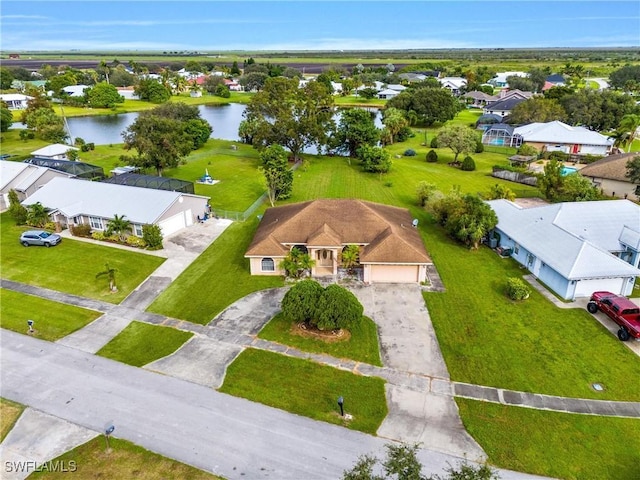 bird's eye view with a residential view and a water view