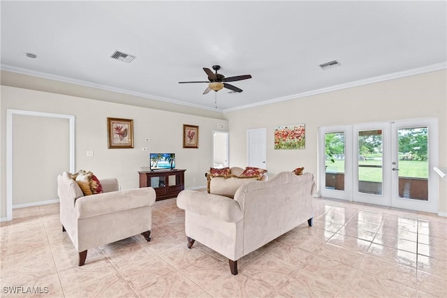 living area featuring visible vents and ornamental molding