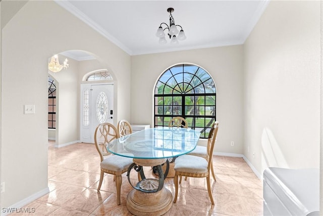 dining area featuring baseboards, crown molding, arched walkways, and an inviting chandelier