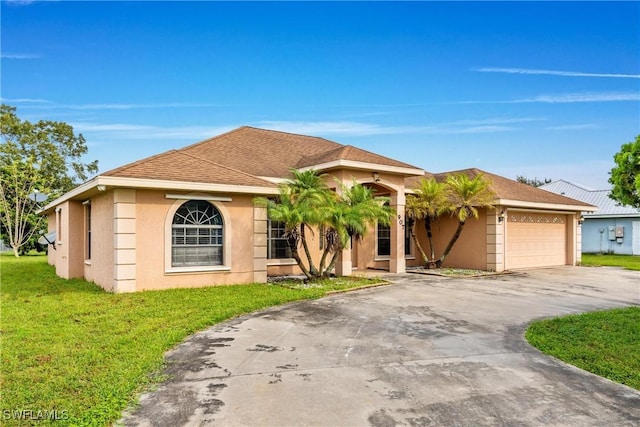 single story home featuring stucco siding, a shingled roof, concrete driveway, a garage, and a front lawn