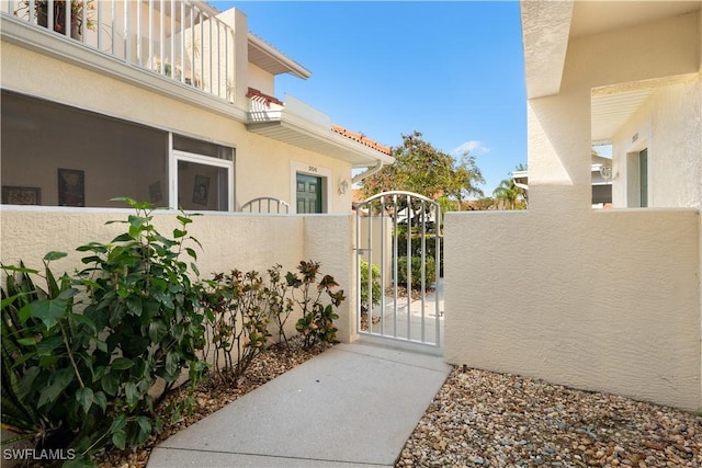 view of gate featuring a fenced front yard