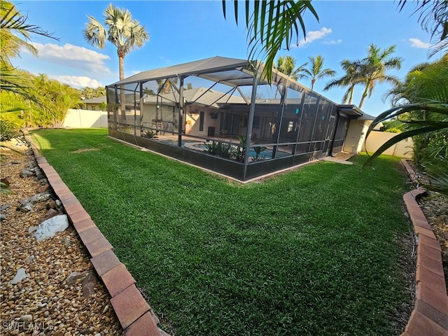 6048 Birnam Wood Ln, Fort Myers, FL 33908 - view of yard with an outdoor pool, a fenced backyard, and a lanai