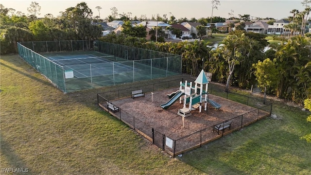 6048 Birnam Wood Ln, Fort Myers, FL 33908 - view of sport court featuring a yard, a residential view, playground community, and fence