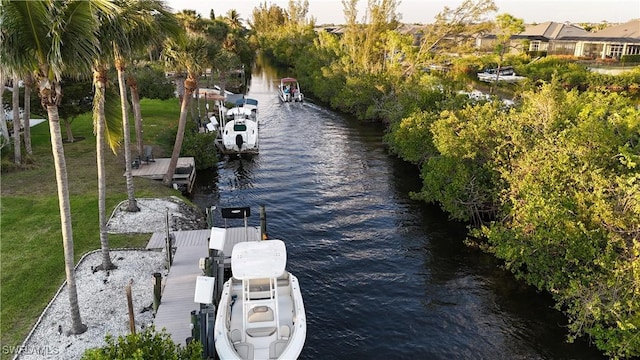 6048 Birnam Wood Ln, Fort Myers, FL 33908 - dock area with a water view and a lawn