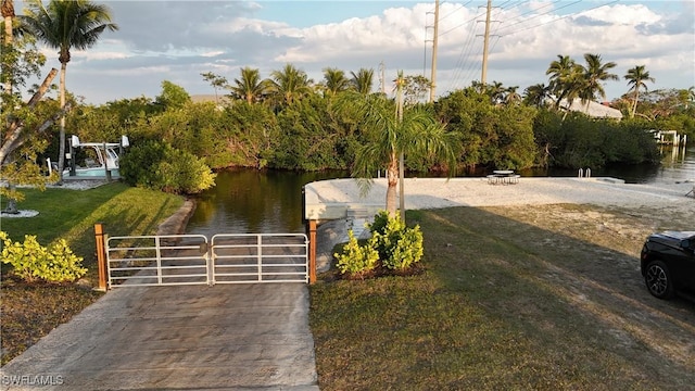 6048 Birnam Wood Ln, Fort Myers, FL 33908 - exterior space featuring a water view and a gate
