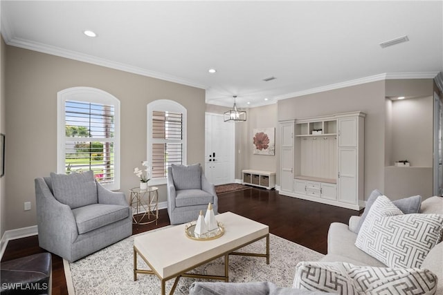 living room with ornamental molding, dark wood finished floors, visible vents, and baseboards