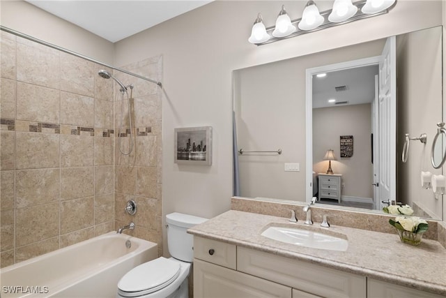 bathroom with visible vents, shower / bathing tub combination, vanity, and toilet