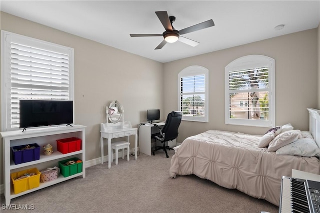 bedroom with carpet floors, ceiling fan, and baseboards