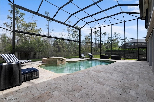 view of swimming pool with a patio, a lanai, and a pool with connected hot tub