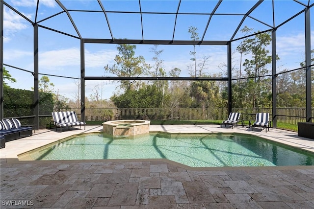 view of swimming pool featuring a lanai, a patio area, and a pool with connected hot tub