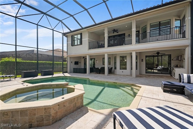 view of swimming pool featuring a ceiling fan, a lanai, a patio, and an outdoor hangout area