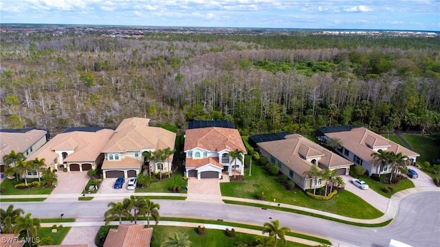 aerial view with a residential view and a wooded view