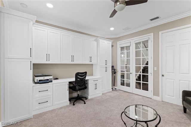 office area with visible vents, light colored carpet, crown molding, built in desk, and recessed lighting