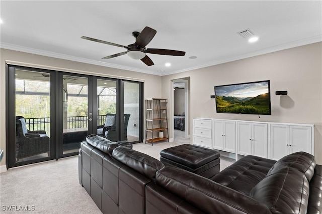 living area featuring ornamental molding, a wealth of natural light, and light carpet