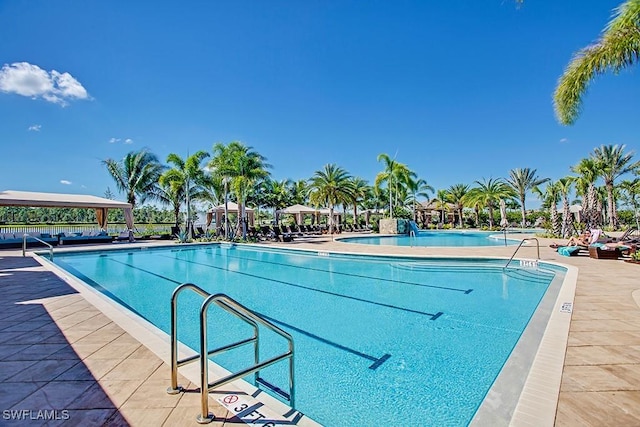 pool with a patio area