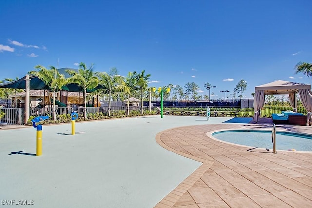 view of pool with a gazebo, a patio, fence, and a pool