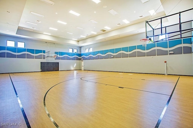 view of basketball court featuring community basketball court and a healthy amount of sunlight