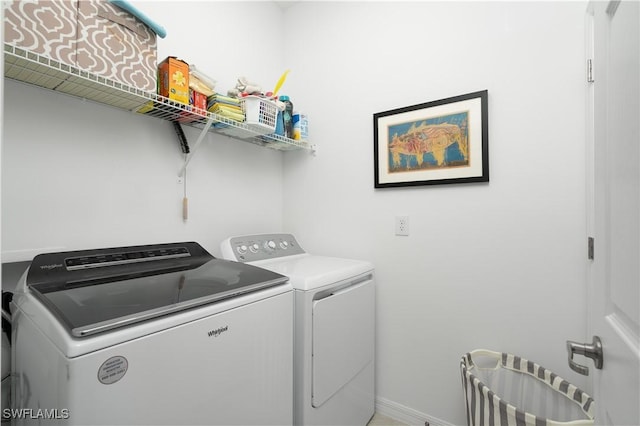 43333 Water Bird Way Unit 4821, Punta Gorda, FL 33982 - washroom featuring separate washer and dryer and baseboards