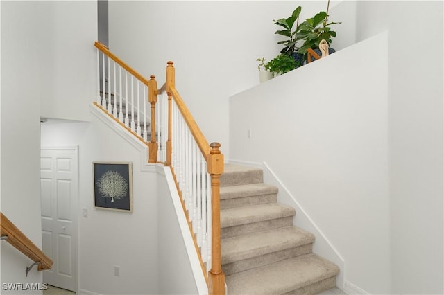 stairs featuring baseboards