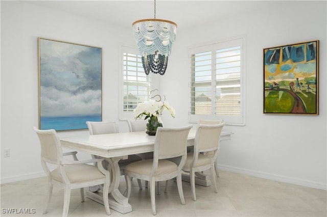 43333 Water Bird Way Unit 4821, Punta Gorda, FL 33982 - dining area featuring a chandelier, plenty of natural light, and baseboards