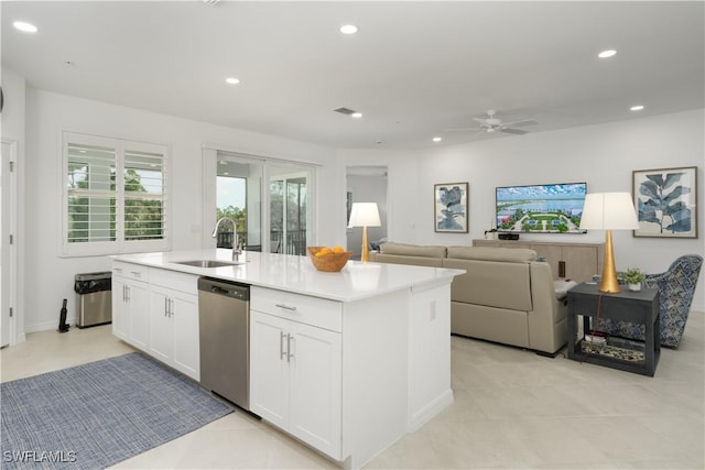 43333 Water Bird Way Unit 4821, Punta Gorda, FL 33982 - kitchen with dishwasher, a sink, a center island with sink, ceiling fan, and white cabinetry