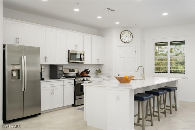 43333 Water Bird Way Unit 4821, Punta Gorda, FL 33982 - kitchen with appliances with stainless steel finishes, a sink, an island with sink, recessed lighting, and white cabinets
