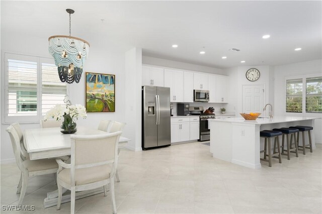 43333 Water Bird Way Unit 4821, Punta Gorda, FL 33982 - kitchen featuring stainless steel appliances, a sink, a chandelier, white cabinetry, and recessed lighting