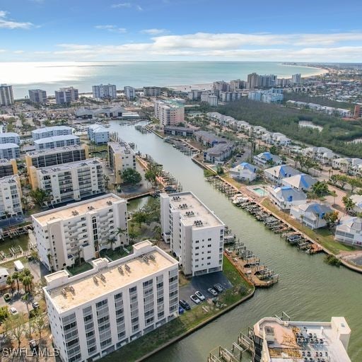 bird's eye view featuring a water view and a city view