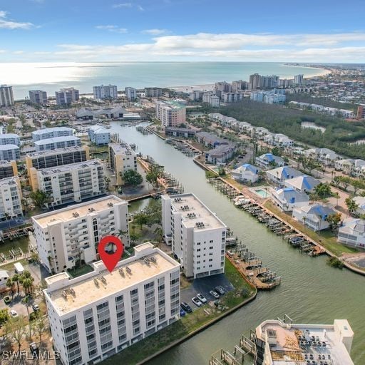 drone / aerial view featuring a water view and a city view