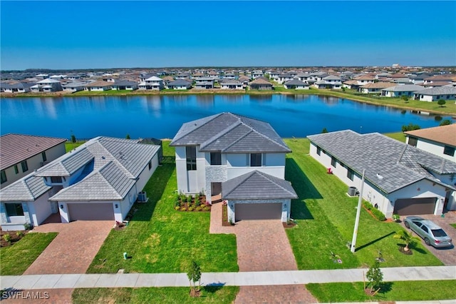 bird's eye view featuring a water view and a residential view