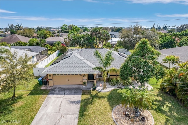 birds eye view of property with a residential view