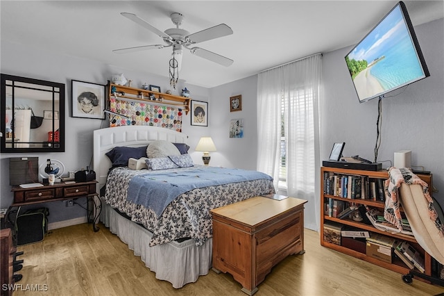 bedroom featuring a ceiling fan and light wood-style flooring