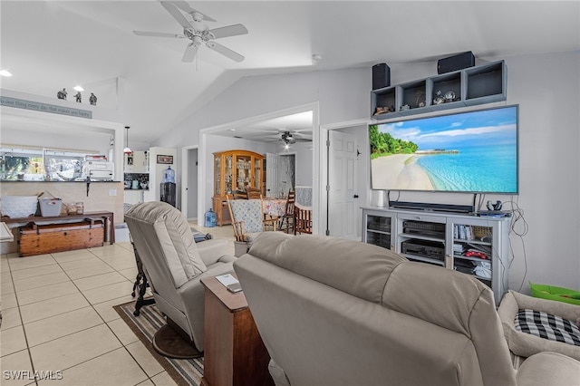 living area featuring ceiling fan, light tile patterned flooring, and lofted ceiling