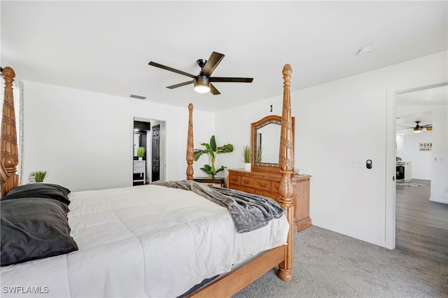 bedroom with baseboards, carpet flooring, visible vents, and a ceiling fan