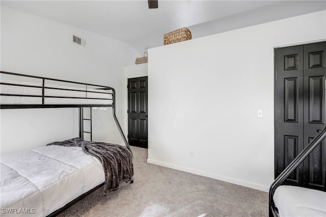 bedroom featuring a ceiling fan, carpet flooring, visible vents, and baseboards