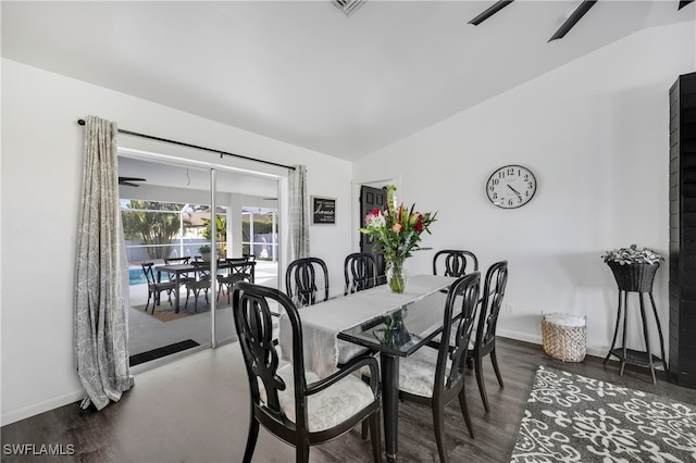 dining room with a ceiling fan, lofted ceiling, and baseboards