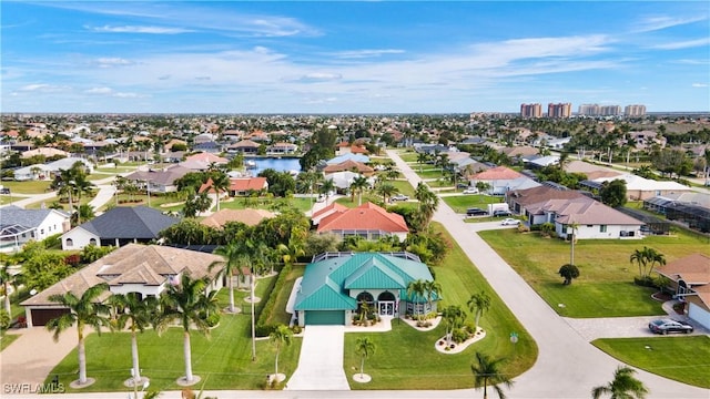 birds eye view of property with a residential view