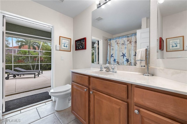 bathroom with toilet, tile patterned flooring, visible vents, and vanity