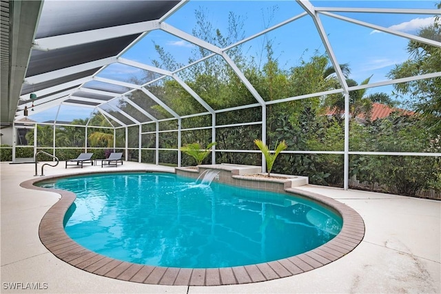 pool featuring a patio and glass enclosure