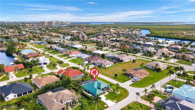 aerial view featuring a water view and a residential view