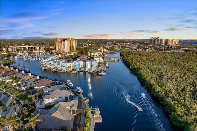 aerial view at dusk with a water view