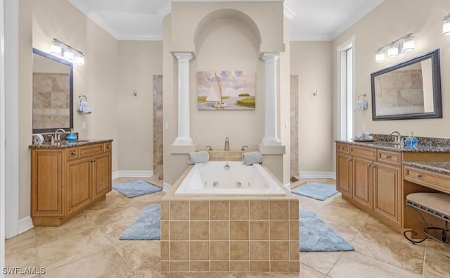 full bath featuring a sink, crown molding, ornate columns, and a tub with jets