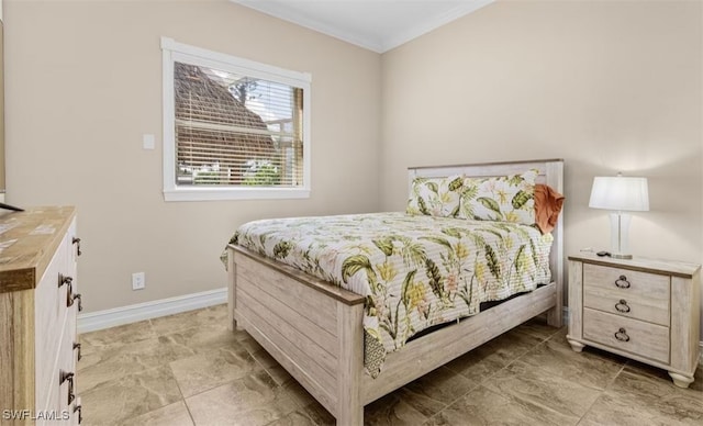 bedroom with baseboards and crown molding