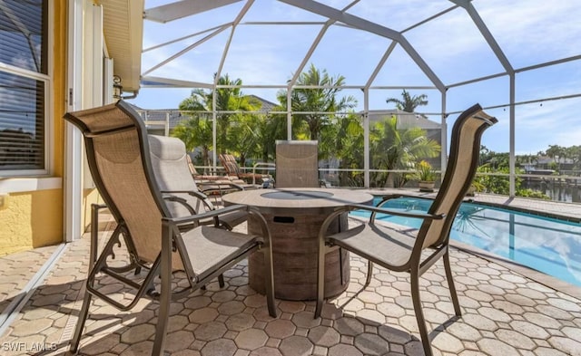 view of patio featuring glass enclosure and an outdoor pool